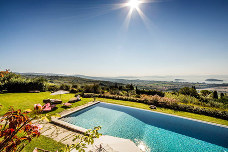 Cortona Villa with Pool with scenic view of countryside and lake under a clear blue sky